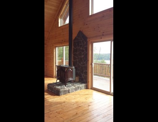 There is a wood stove in the middle of the room.