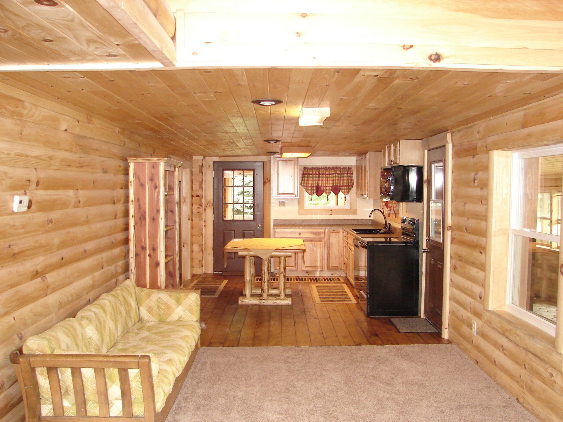 A kitchen with wooden cabinets and granite counter tops