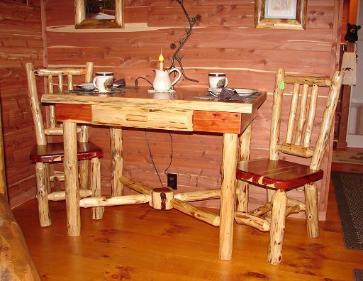 A wooden table and chairs in a room with a wooden wall