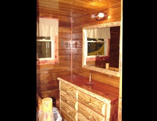 There is a dresser and a mirror in the room.