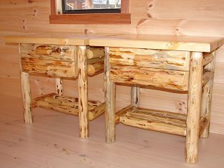 A wooden table with two drawers and a shelf underneath it in a room.