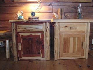 Two wooden nightstands are sitting next to each other on a wooden floor.