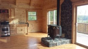 There is a wood stove in the middle of the room.