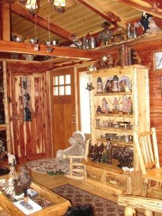 A living room with a teddy bear sitting in a chair