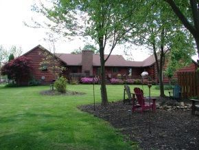 A large house with a large lawn in front of it