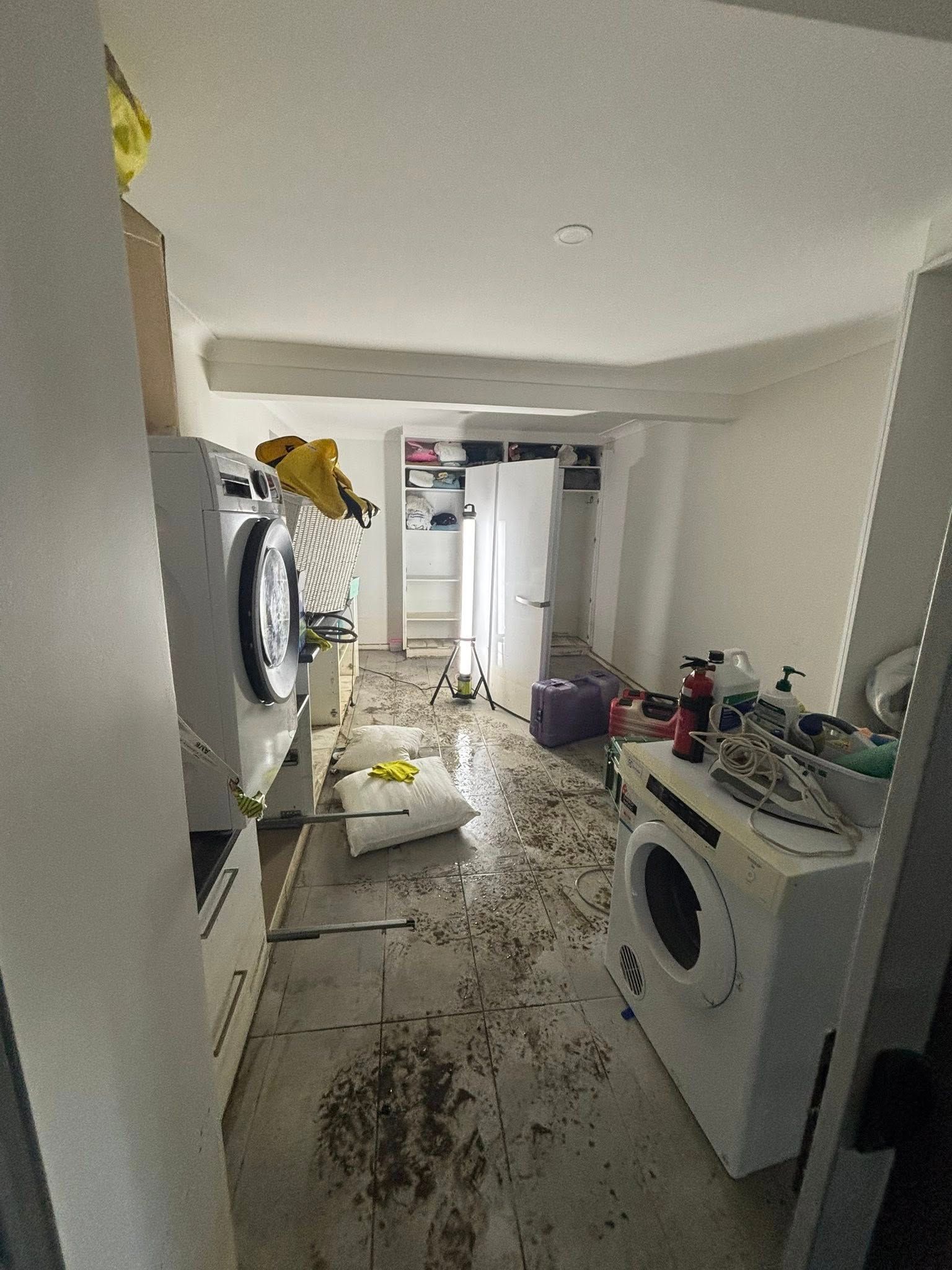 Laundry Room With Appliances and Debris — Brayden Stewart Building In Tuncurry, NSW