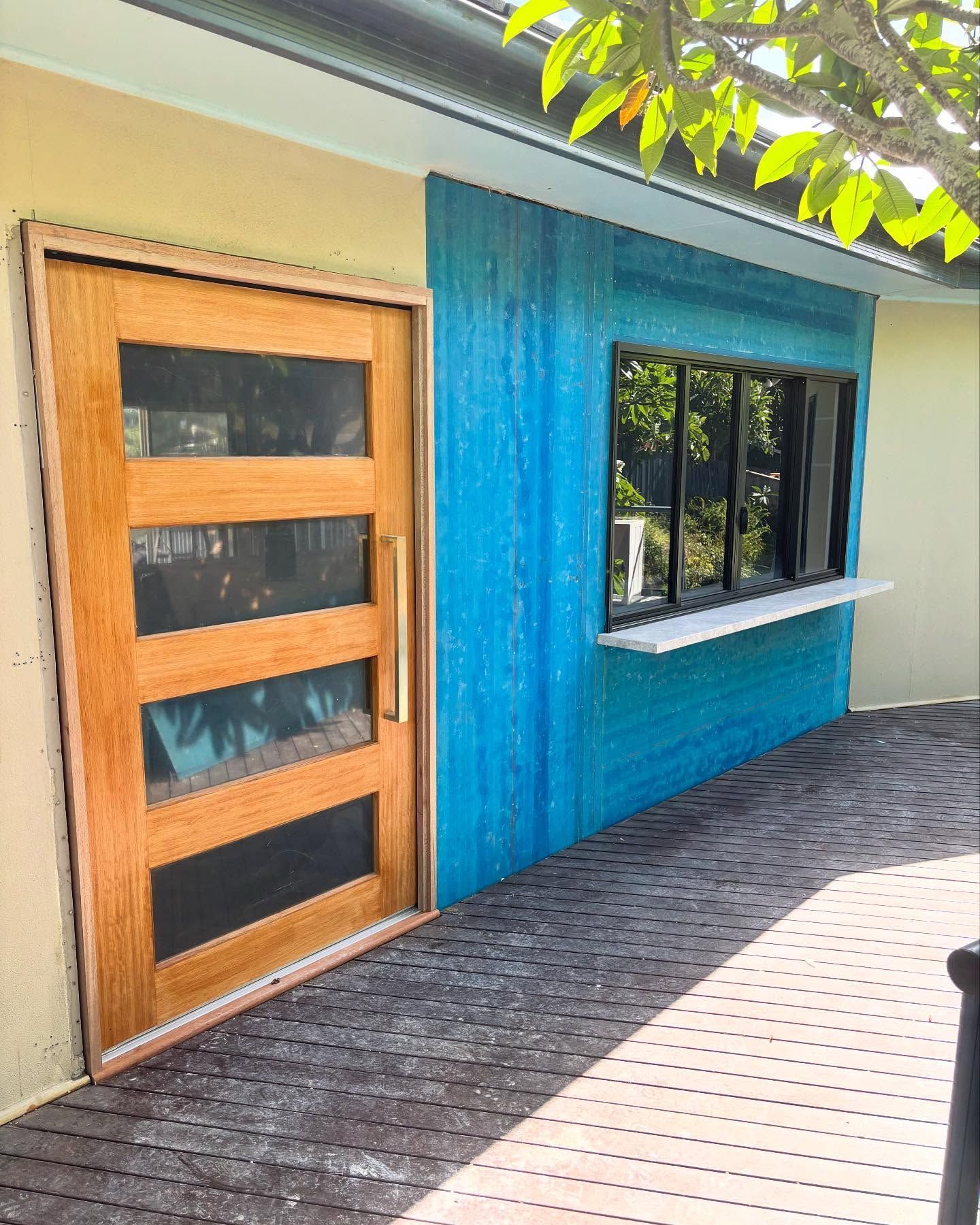 Wooden Door With Glass Panels and a Blue Wall — Brayden Stewart Building In Tuncurry, NSW