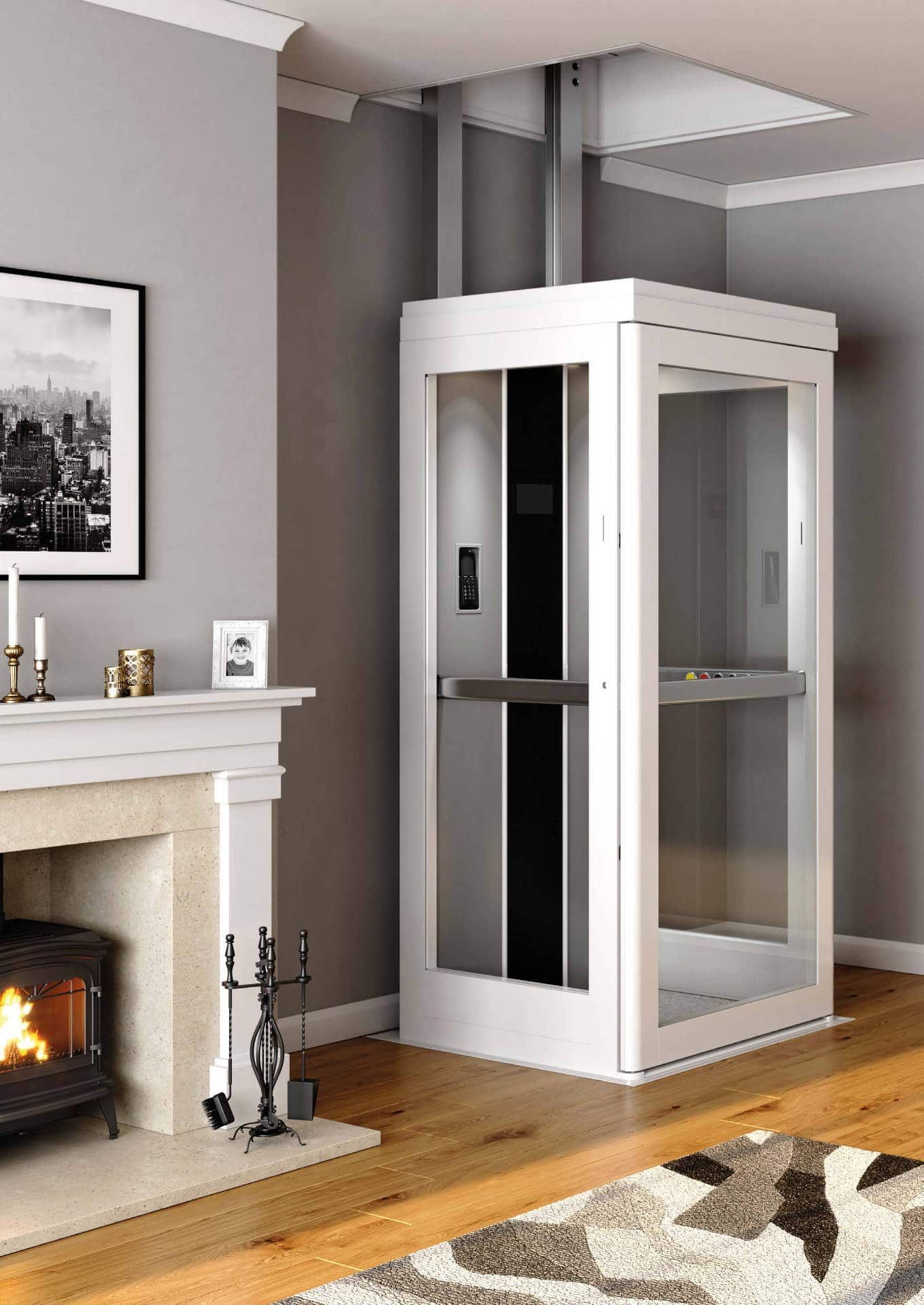 A white residential through-floor lift with glass panels installed in a living room next to a fireplace.