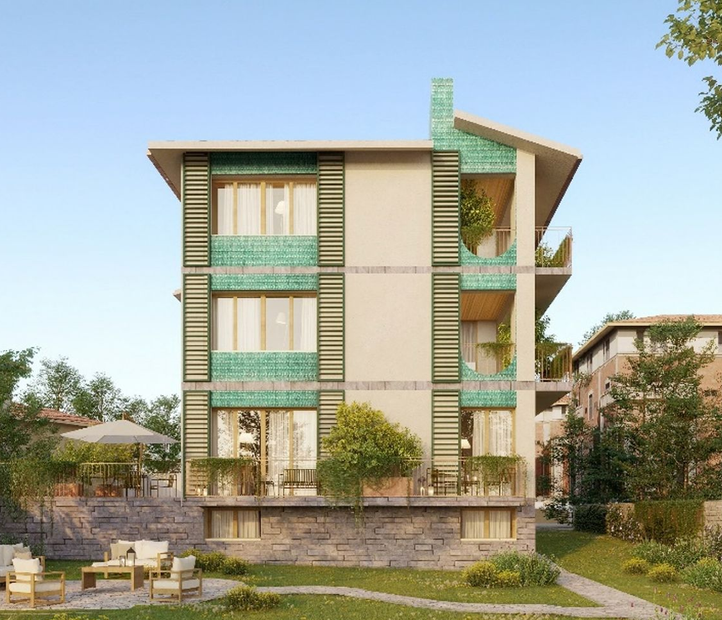 Edificio a più piani con accenti verdi e balconi.