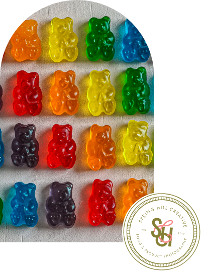A bunch of colorful gummy bears on a shelf