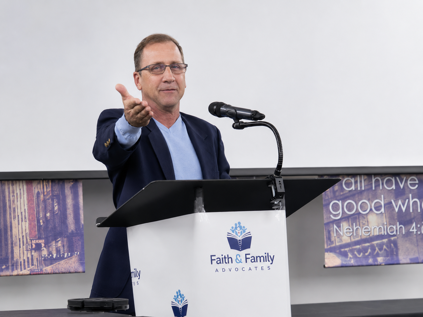 Brody Howell speaking onstage at a ministry event