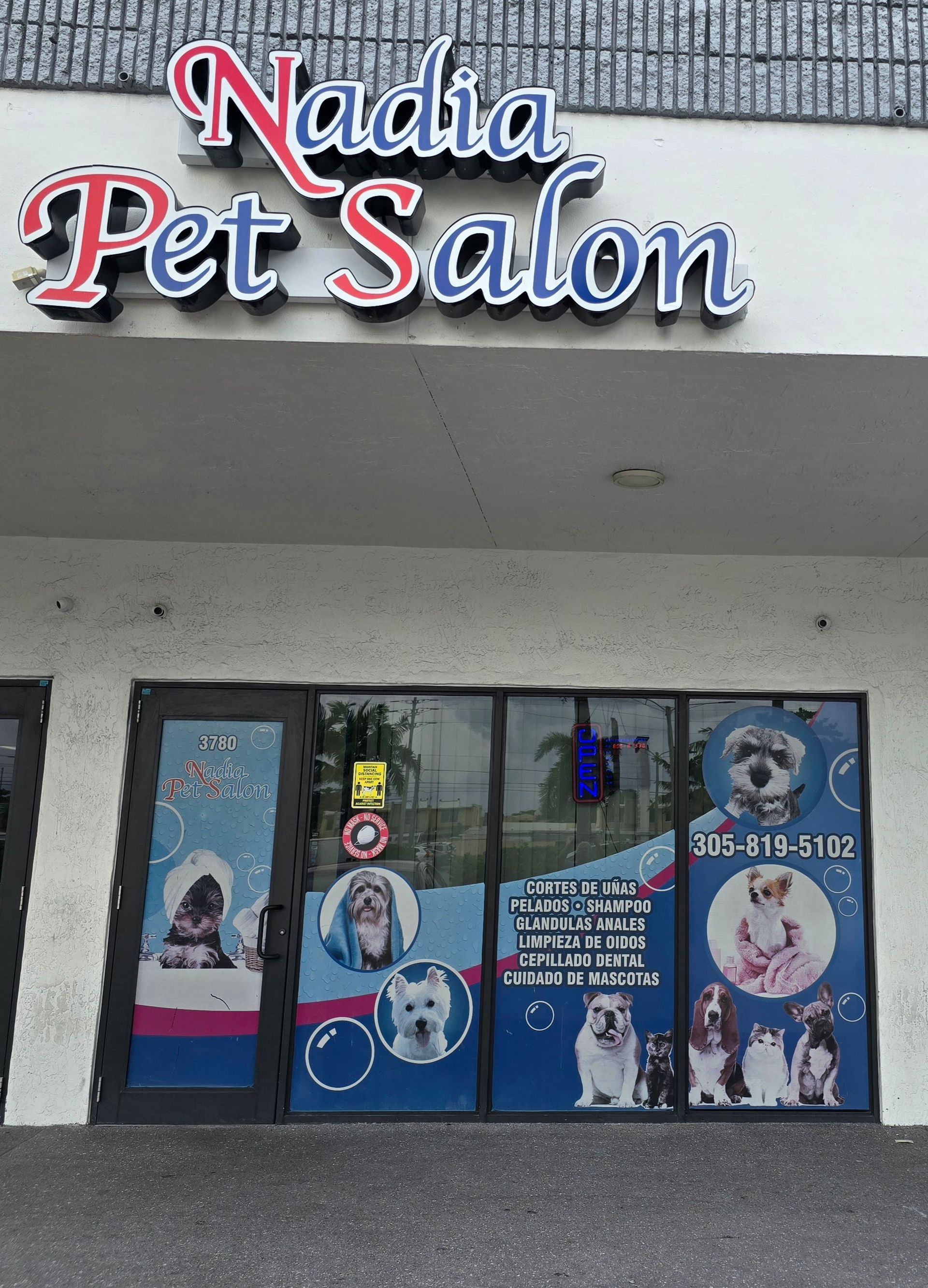 A pet salon with a sign that says nadia pet salon