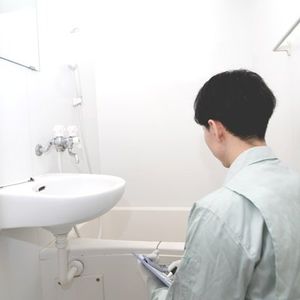 Professional Inspector Inspecting Bathtub Professional Inspector Inspecting Bathtub