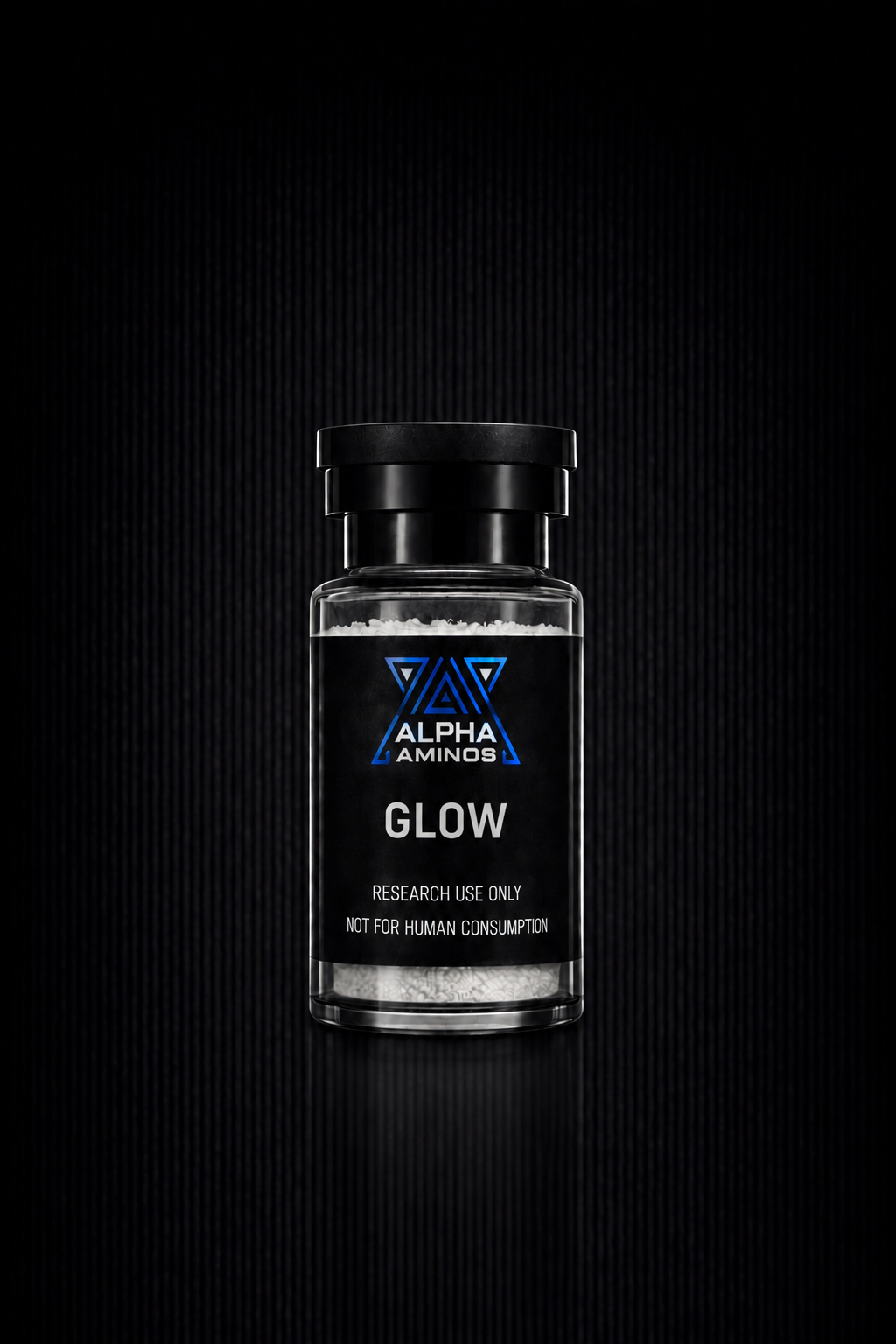 Black glass bottle labeled “ALPHA GLOW” on a dark background