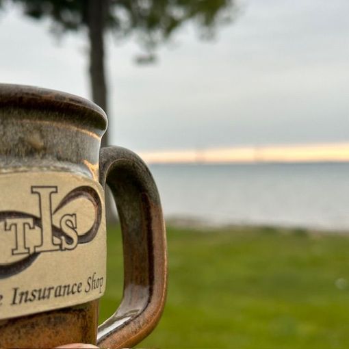 A close up of a mug that says tls on it