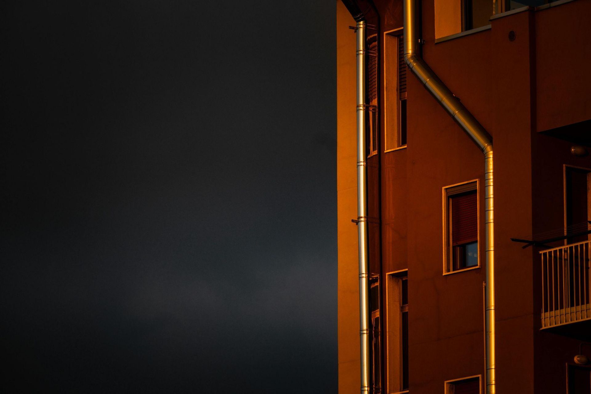 Gutter and downspout system on a building exterior
