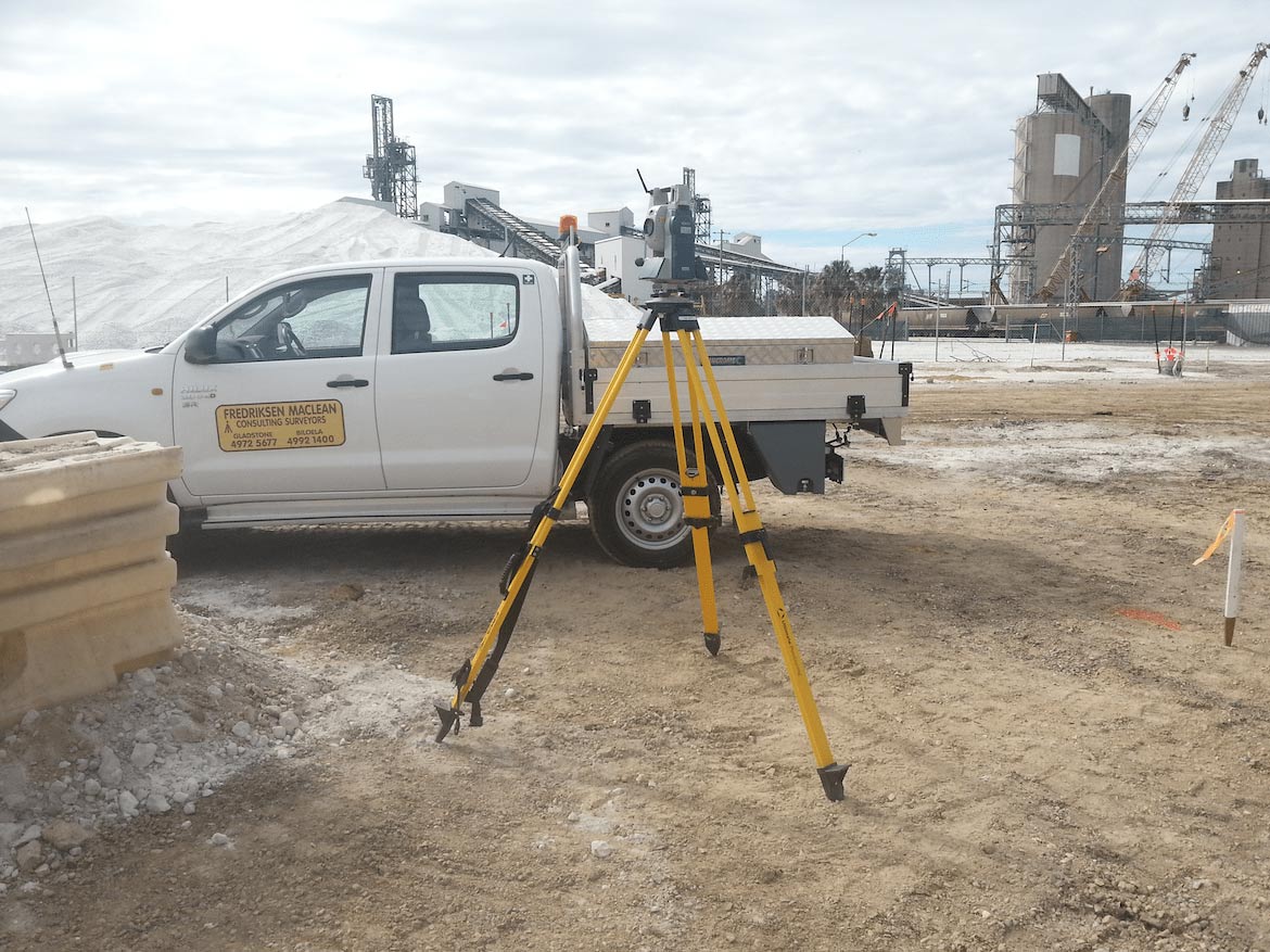 Surveyor on the car — Fredriksen Maclean and Associates in Gladstone, QLD
