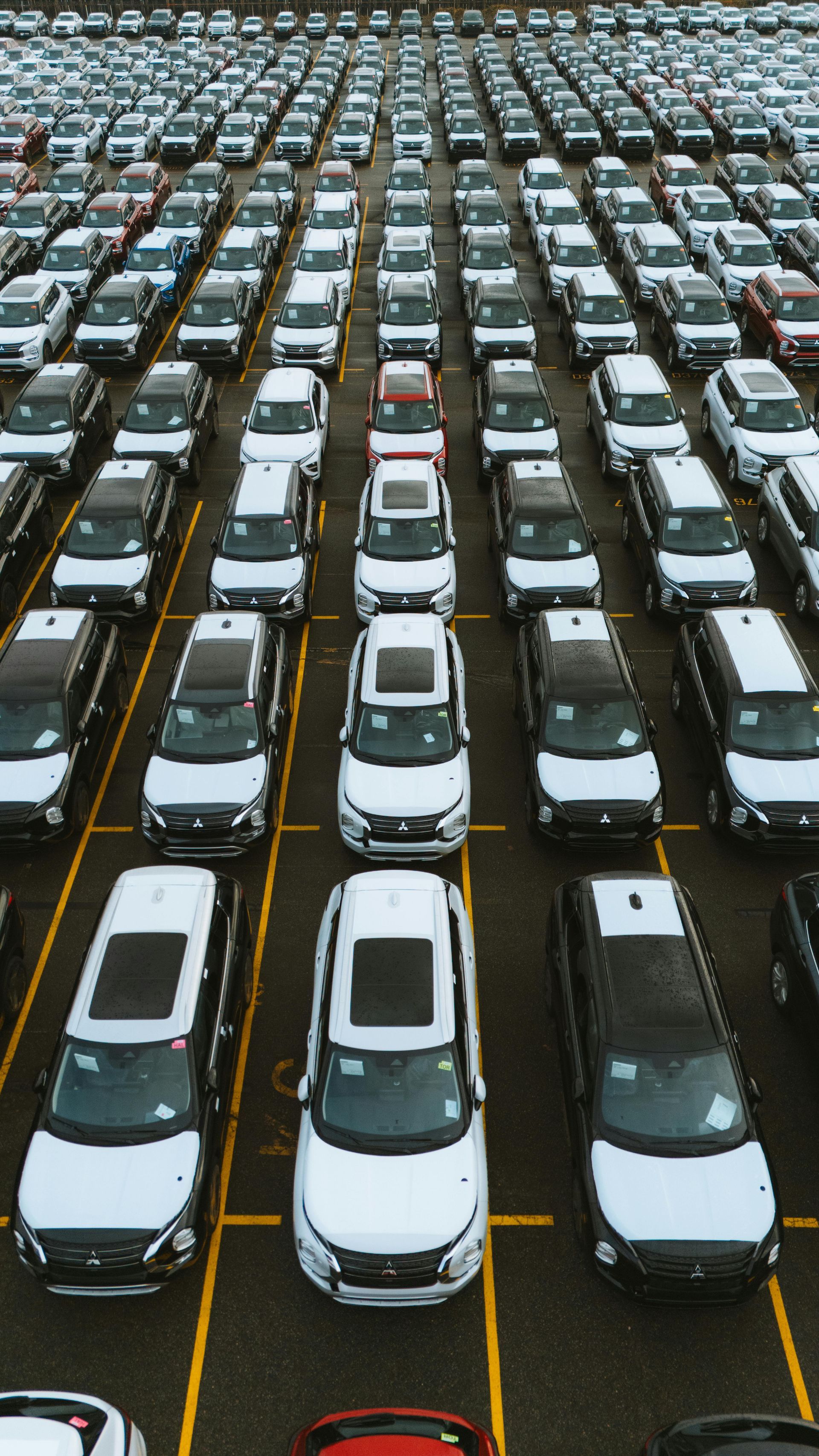 A lot of cars are parked in a parking lot.