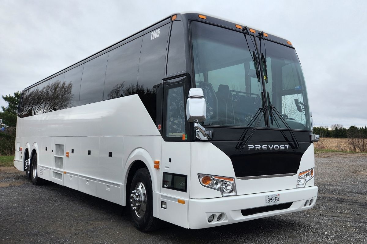 white 56-passenger motorcoach