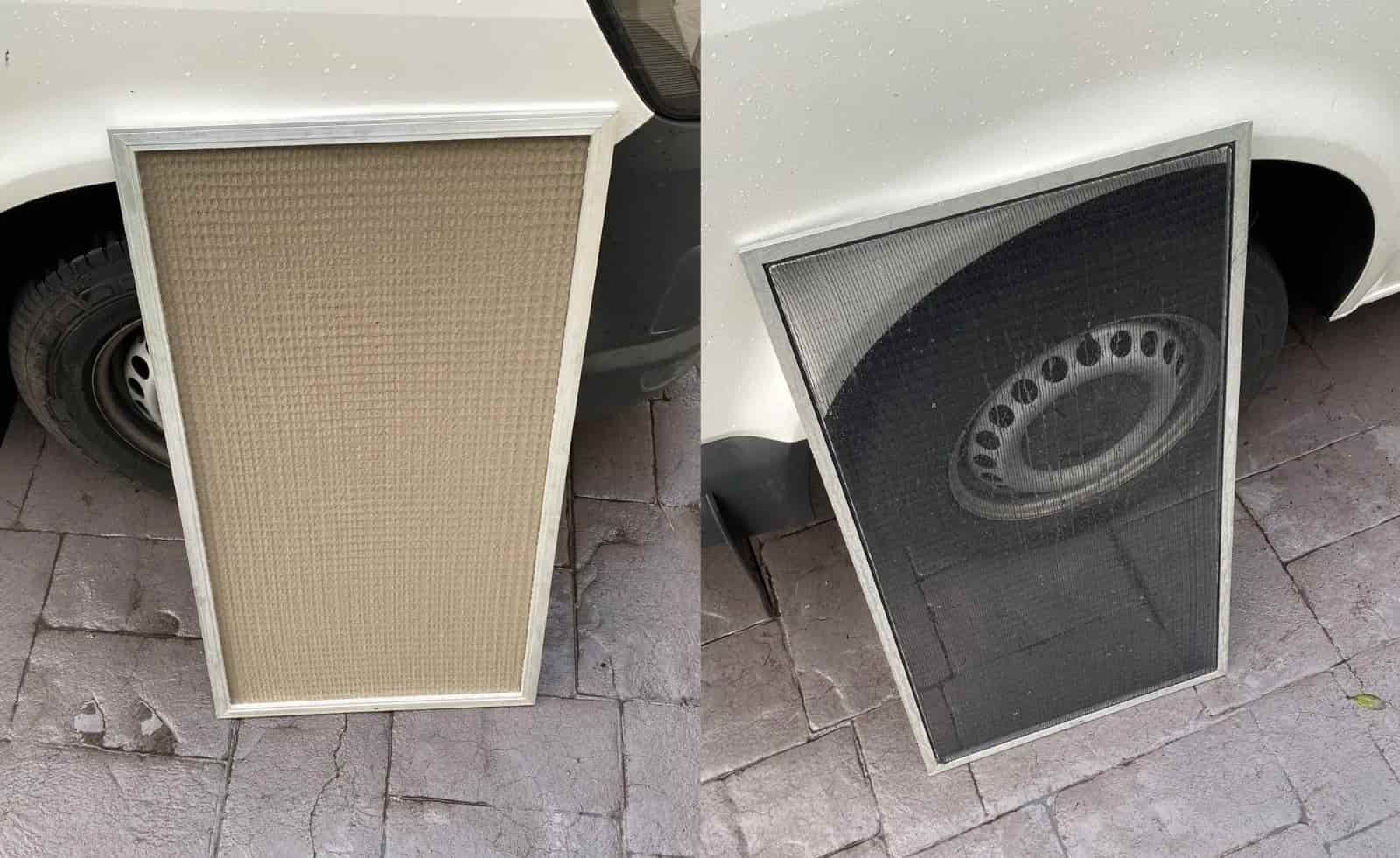 Two Screens Are Sitting on the Sidewalk Next to a Car — Cool Heat Air Conditioning in Albion Park, NSW