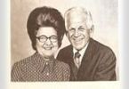 Portrait of Bill & Gladys Adams, posing side by side in a vintage black-and-white photo.