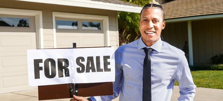 Real estate agent holding a