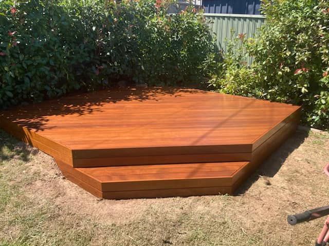 A Wooden Deck with Stairs and A Fence in The Background — P & M Maintenance Building Services in Yass River, NSW