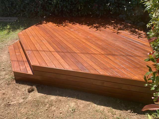 A Wooden Deck Is Sitting on Top of A Dirt Field — P & M Maintenance Building Services in Yass River, NSW