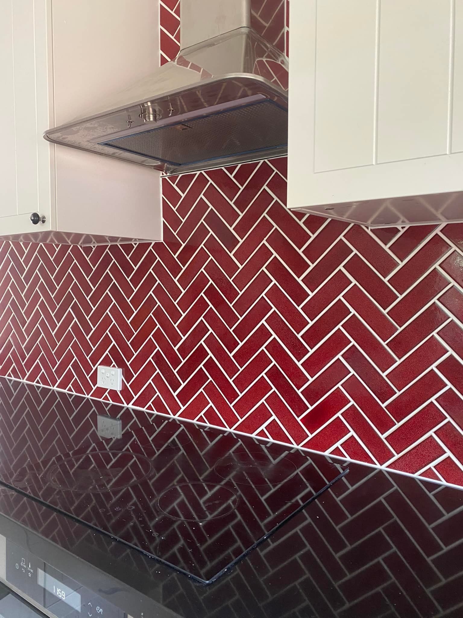 A Kitchen with Red Tiles in A Herringbone Pattern — P & M Maintenance Building Services in Murrumbateman, NSW