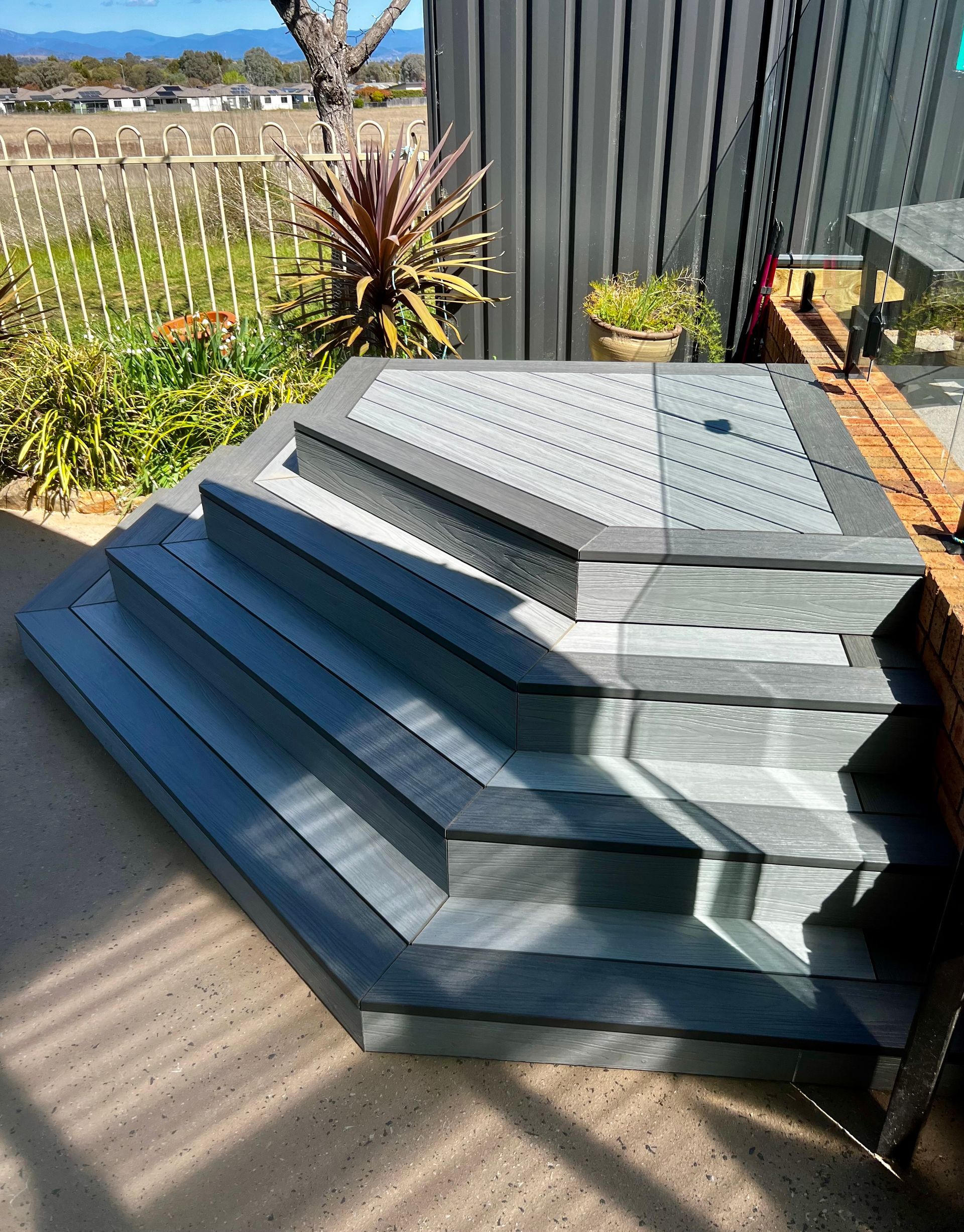 A Stack of Stairs Sitting on Top of Each Other in A Garden — P & M Maintenance Building Services in Yass River, NSW
