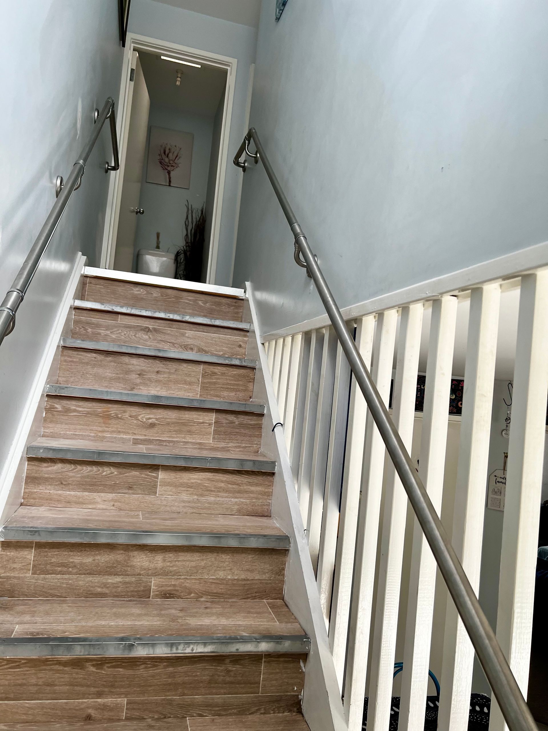 A Set Of Stairs With A Handrail — P & M Maintenance Building Services in Yass River, NSW