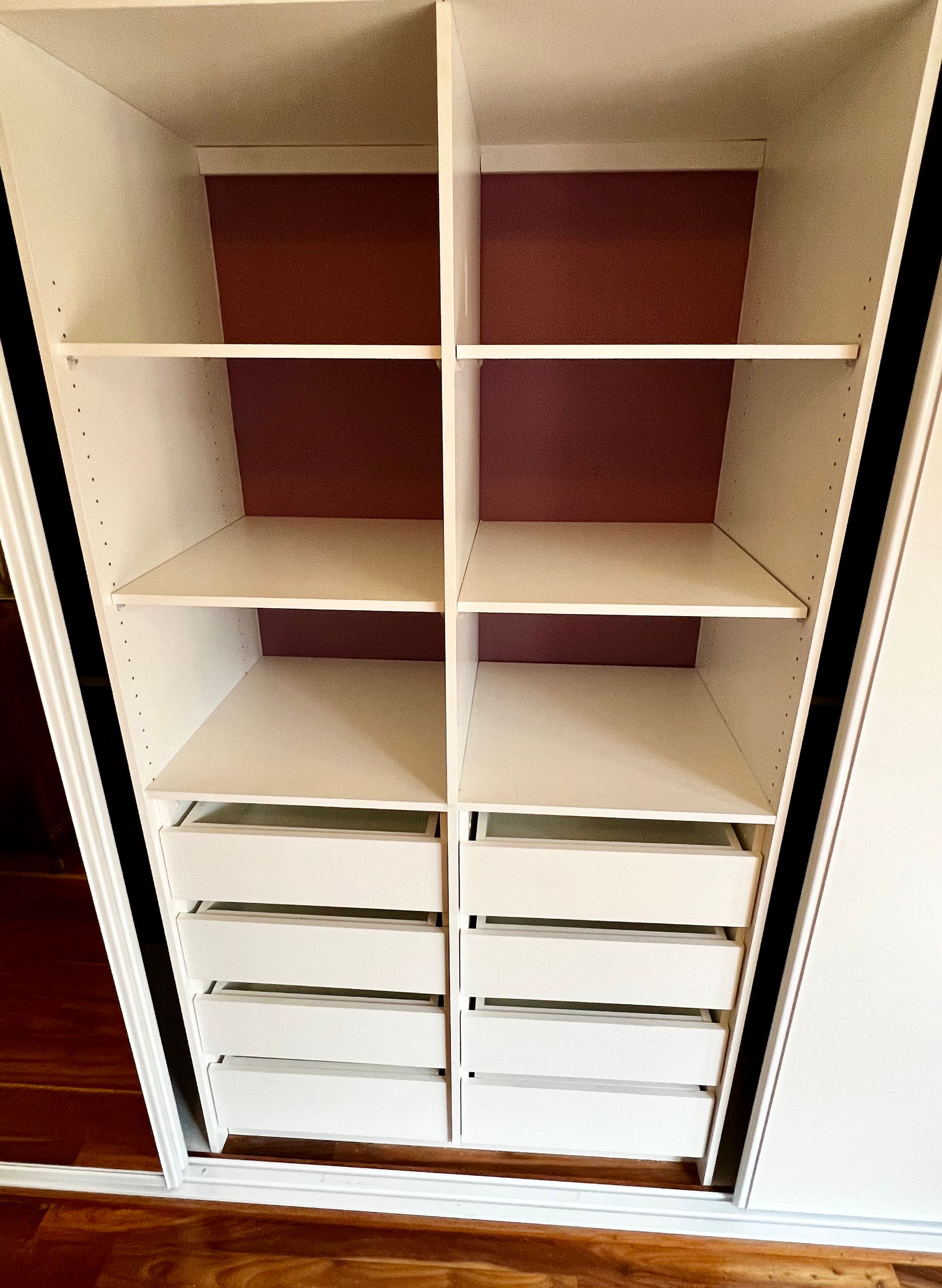 The Inside of A Closet with Shelves and Drawers — P & M Maintenance Building Services in Belconnen, ACT