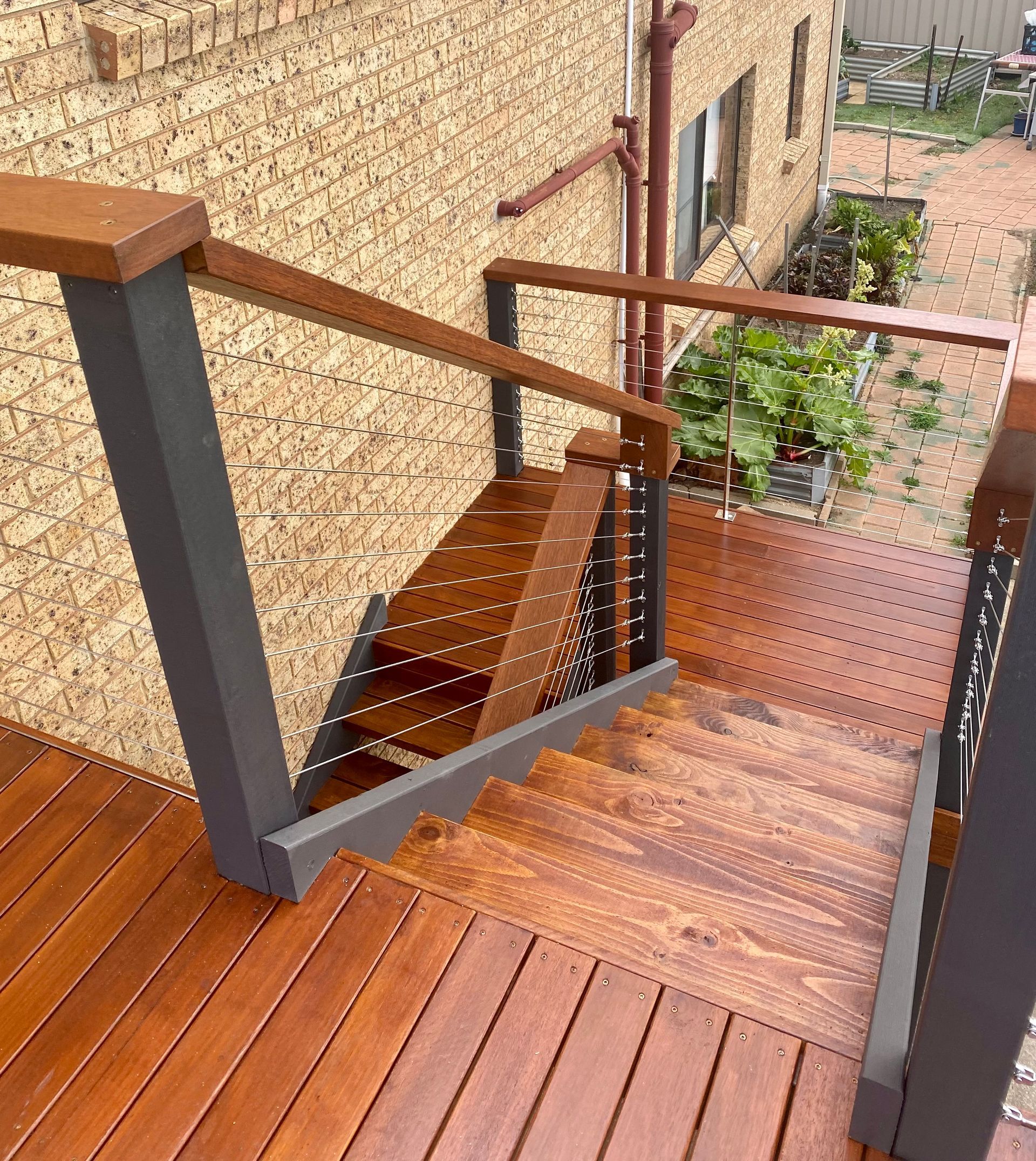 A Deck With Stairs Leading Down — P & M Maintenance Building Services in Yass River, NSW