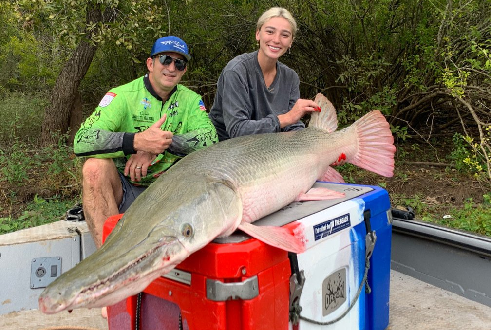 giant alligator gar on a cooler with client