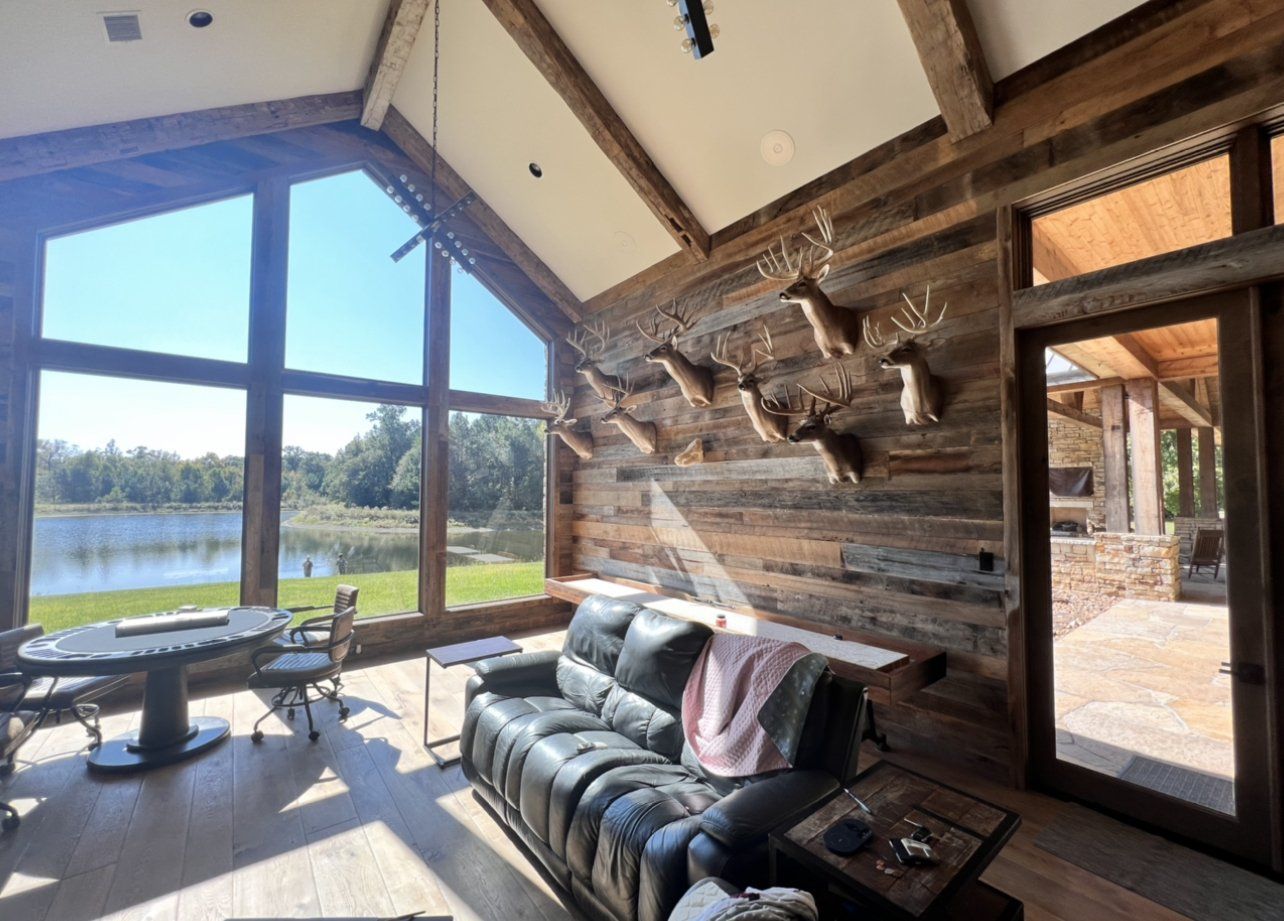 Great room with stone fireplace inside the 10,000 square foot Ellisor Lodge