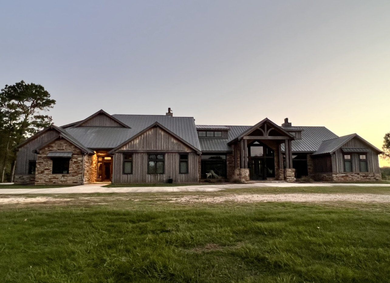 Ellisor Lodge exterior at dusk, hog hunting lodging in the Trinity River bottom Texas
