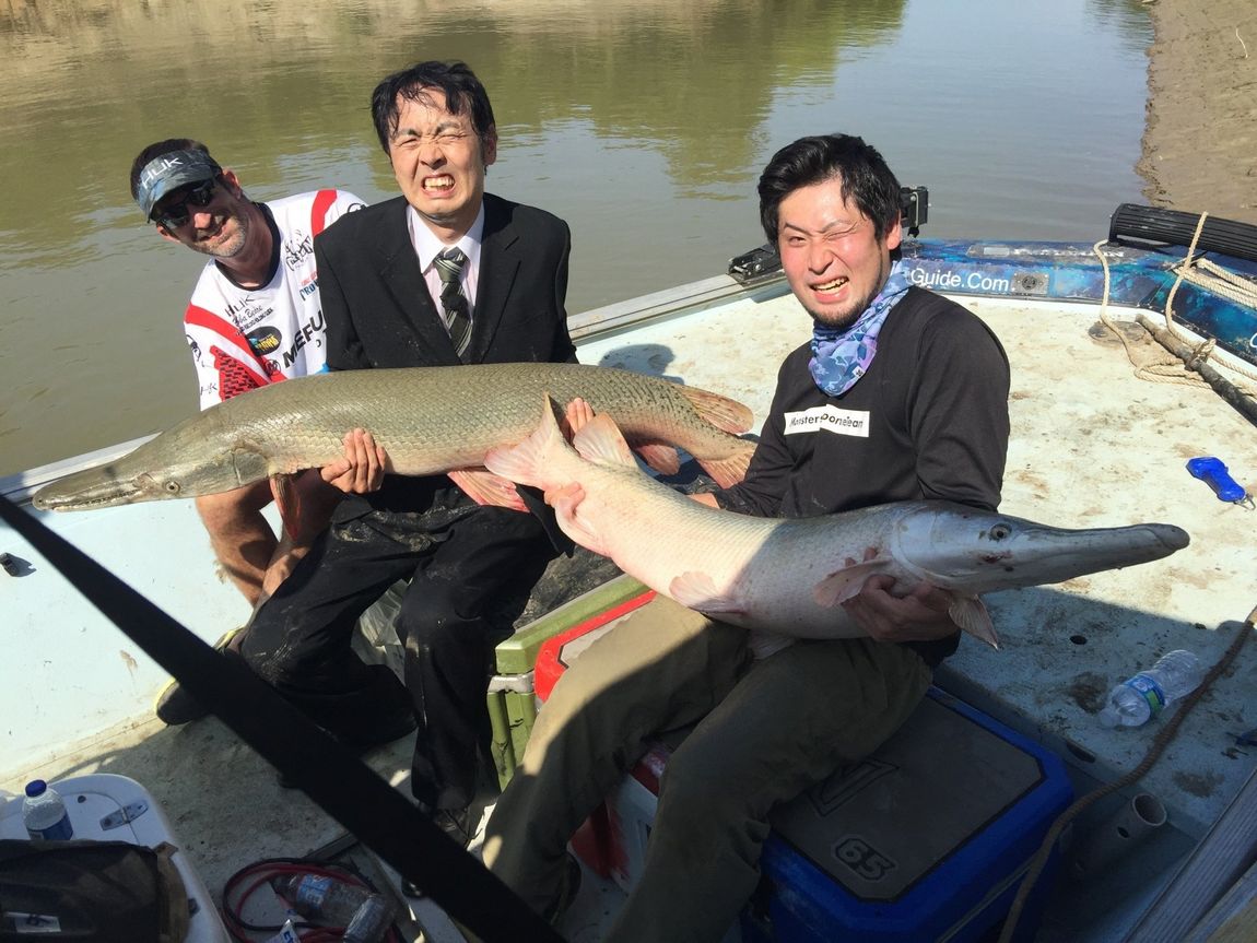 Japanese wearing a suit while gar fishing in Texas 