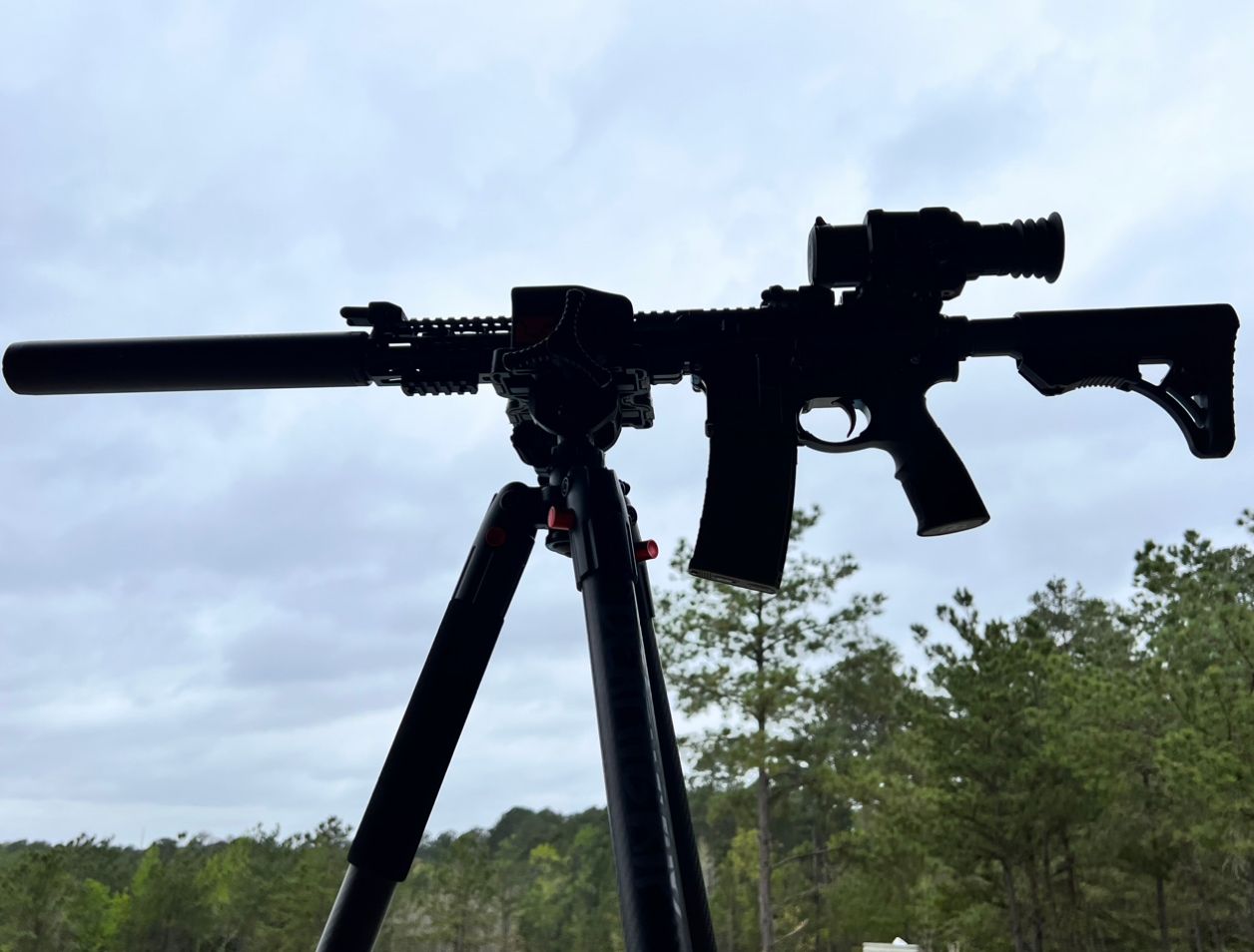 Suppressed AR rifle with thermal scope on a tripod, Hogzilla thermal hog hunting gear
