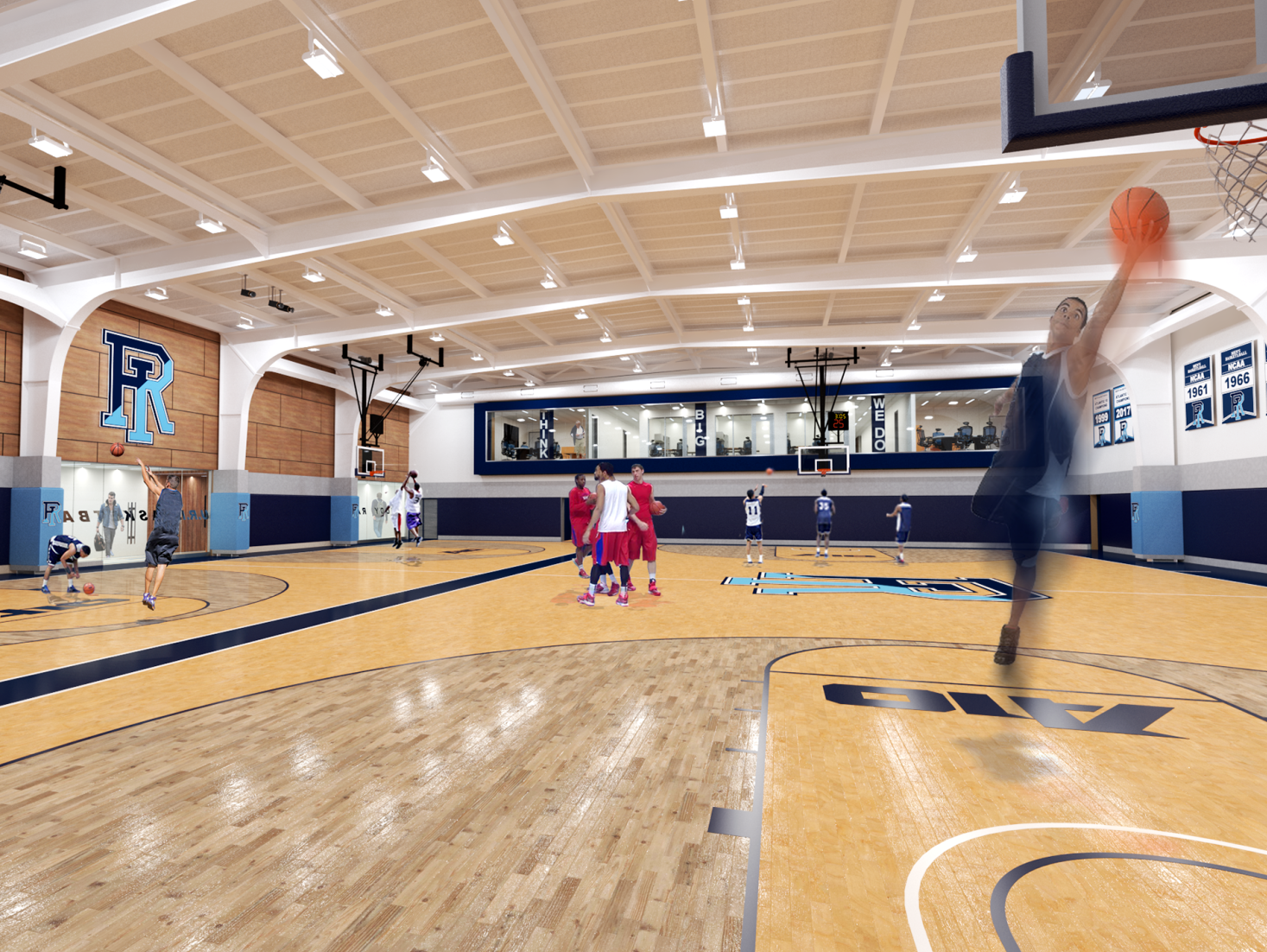 A group of people are playing basketball in a gym.