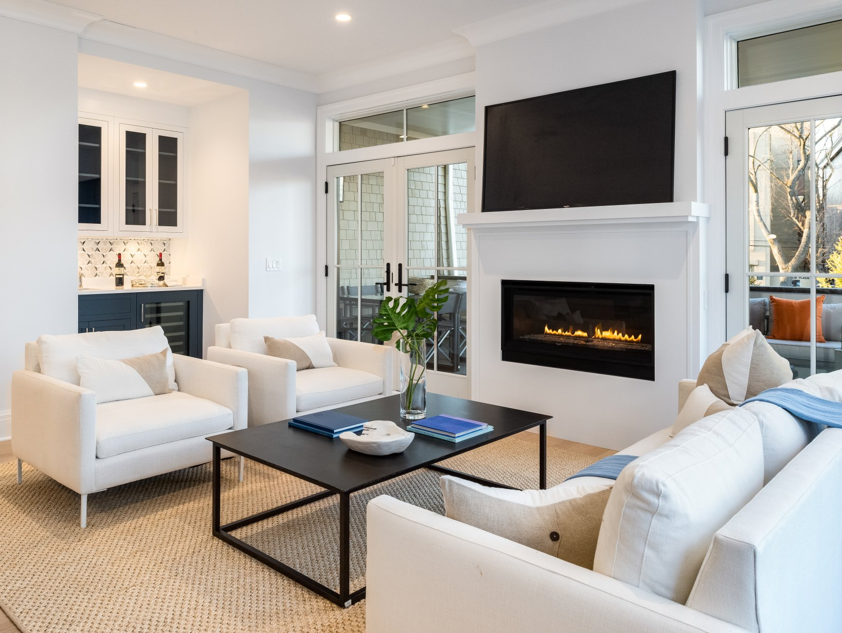 A living room filled with furniture and a fireplace.