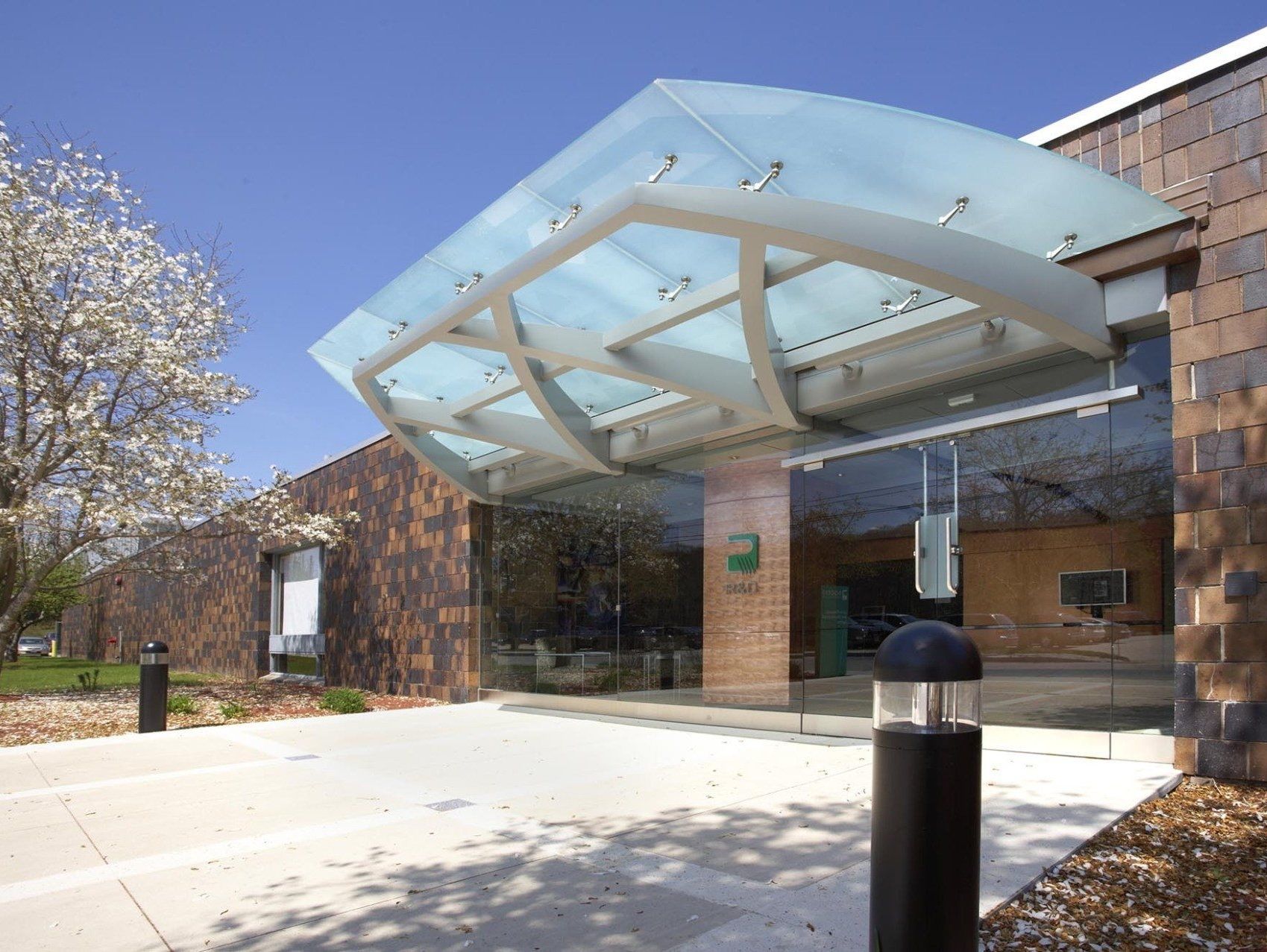 A building with a glass canopy over the entrance
