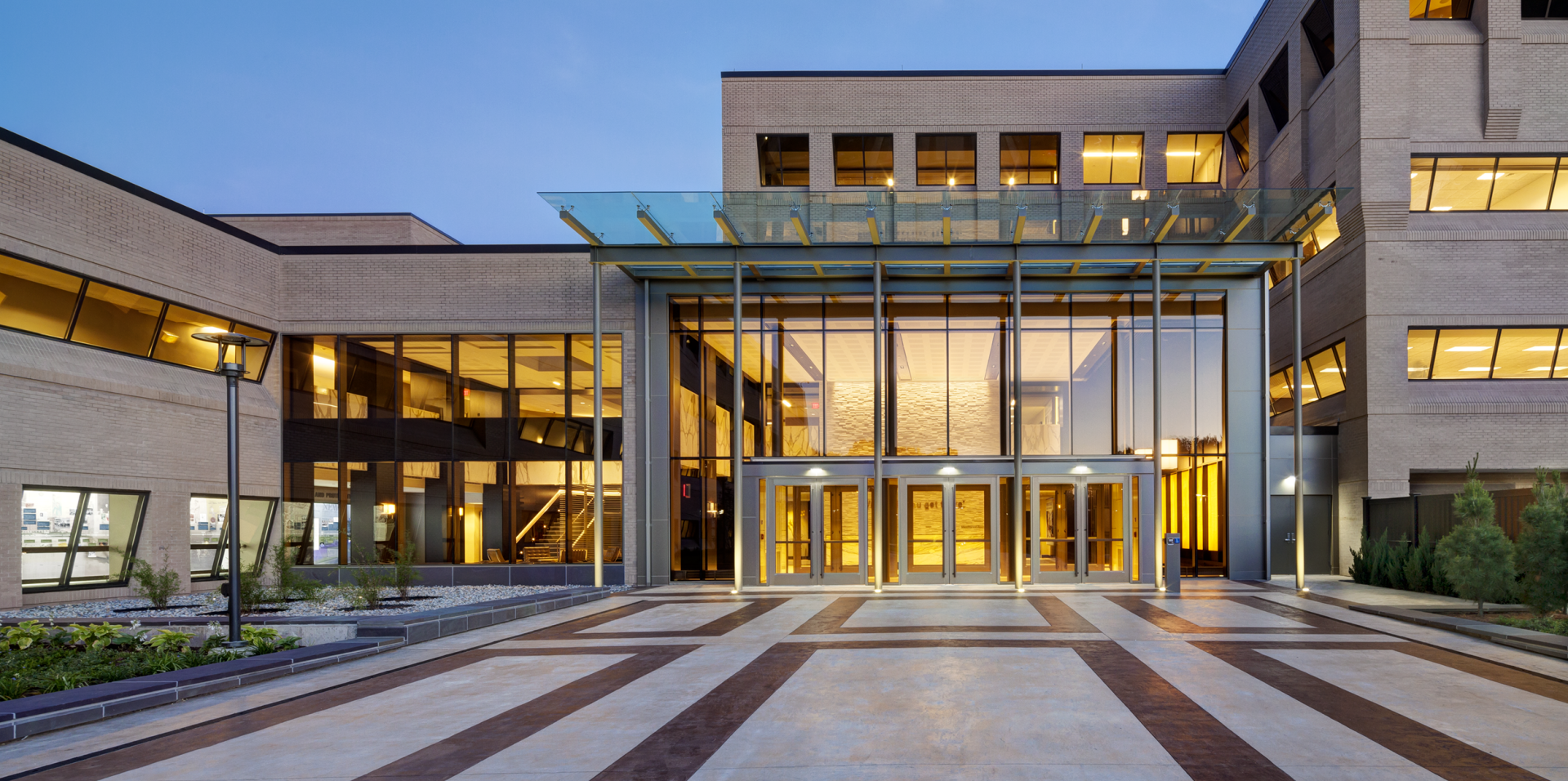 A large building with a glass canopy over the entrance