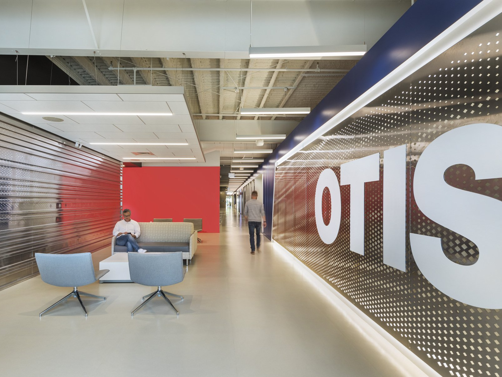 A long hallway with the word otis on the wall