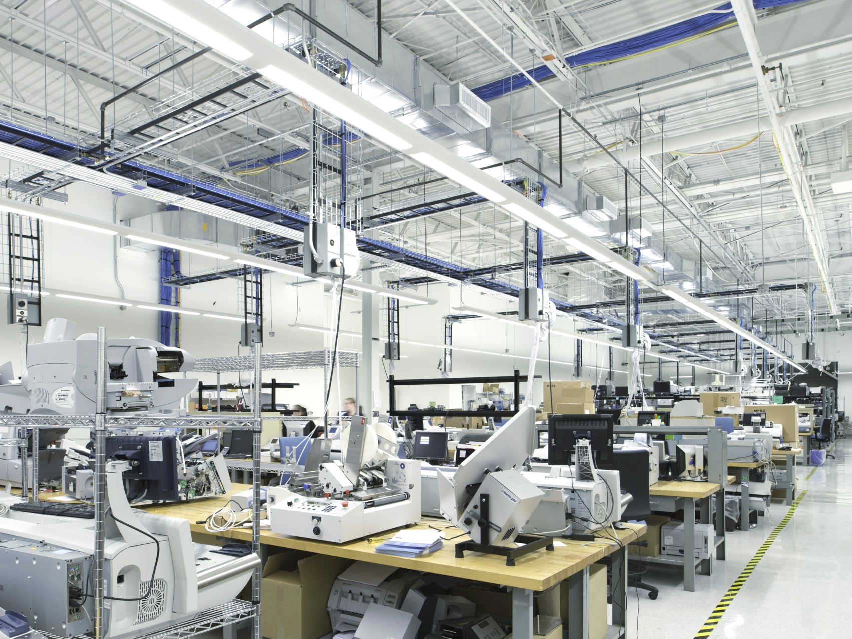 A factory filled with lots of tables and machinery.