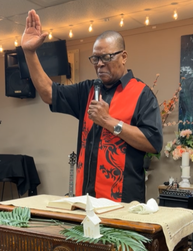 Church members praying with community residents