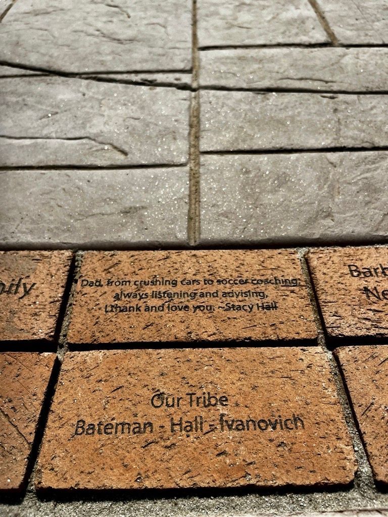 Brick walkway with engraved names and messages. 