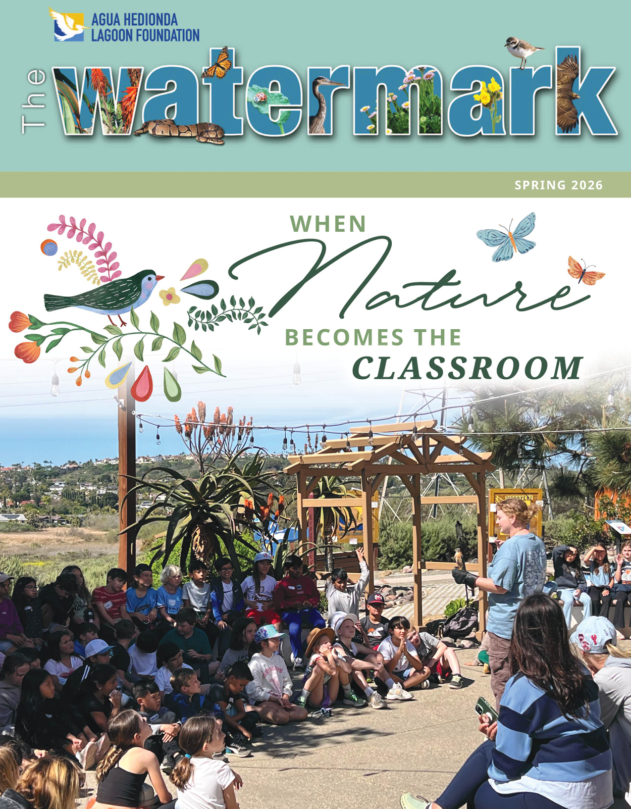 Watermark magazine cover showing an outdoor classroom with students under a shaded structure and birds flying overhead