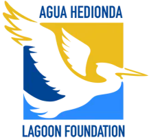Logo of the Agua Hedionda Lagoon Foundation: a white bird flying against blue and yellow blocks.
