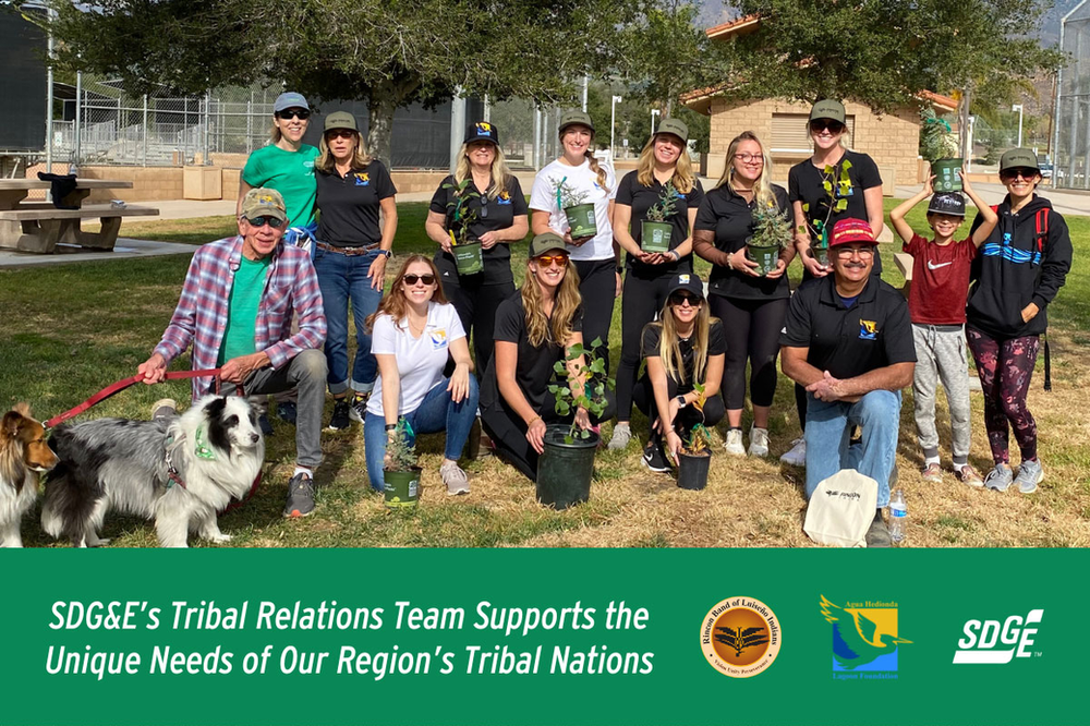 Group of people with potted plants at park, supporting tribal nations. SDG&E logo.