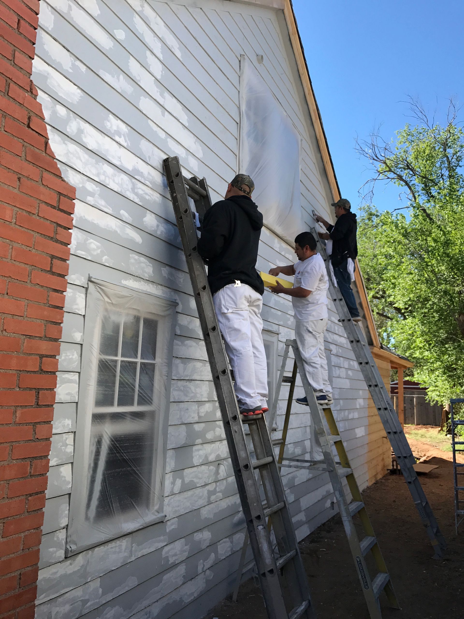 Workers Painting the Exterior of House — Lubbock, TX — DM Painting